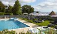 Outdoor swimming pool, hot tub and sun loungers with parasols, Luccombe Manor, Shanklin, Isle of Wight, Hotel, seaside location, sea view