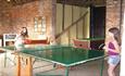 Girls playing with table tennis at Old Barn Touring Park, Sandown