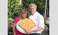 Owners holding their famous homemade Shanklin pie at Vernon Cottage, Isle of Wight, local produce