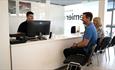 Man and woman sitting at Premier Rental with Premier Rental team, Isle of Wight, car hire, van hire