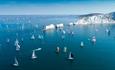 Yachts passing the Needles in the Round the Island Race, Isle of Wight, What's On - Image credit: Paul Wyeth