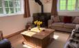 Isle of Wight, Accommodation, Rowborough Cottage, Image Showing living room with wood burning stove