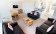 Isle of Wight, Accommodation, Seaview Holidays, image of chalet interior showing living area, dining area and kitchen area