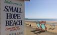 Beach sign and deck chairs on the beach at Small Hope Beach, Shanklin, Isle of Wight, Things to Do