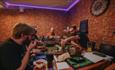 Isle of Wight, Things to Do, eating out, Newport, Snacks and Ladders, Board Game cafe, group playing board game and eating