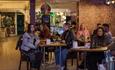 Isle of Wight, Things to Do, eating out, Newport, Snacks and Ladders, Board Game cafe, group seated in cafe