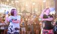 Two adults showing children the dance moves at Tapnell Farm Park, Isle of Wight, Summer fun, family, children's events, what's on, party, activities,