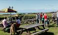 Outside seating in the garden with seaviews at The Sun Inn, Hulverstone, Isle of Wight pub