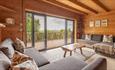 Living area inside a Wood Cabin at Tom's Eco Lodge, Tapnell Farm Holiday Destination, self-catering, West Wight, Isle of Wight