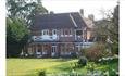 Outside view of the back of The Hermitage B&B and garden, bed and breakfast, Isle of Wight.