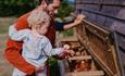 Isle of Wight, Tapnell Farm Holiday Destination, Tom's Eco Lodge, collecting fresh eggs straight from the hens