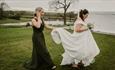 Isle of Wight, Wedding Venue, Westover Farm, Calbourne, Bride and Bridesmaid walking in front of lake