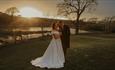 Isle of Wight, Wedding Venue, Westover Farm, Calbourne, Bride and Groom in front of lake with sun setting