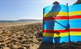 Girl with bucket and spade on Yaverland Beach, Sandown, Isle of Wight, Things to Do