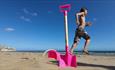 Boy next to bucket and spade on Yaverland Beach, Sandown, Isle of Wight, Things to Do