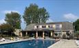 Outside view of The Core Complex overlooking the swimming pool at Appuldurcombe Gardens Holiday Park, Isle of Wight