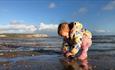 Child playing with the sand on Sandown beach, Sandringham Hotel, Sandown, Isle of Wight, accommodation, coastal hotel, sea view rooms, family friendly
