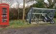 Phone box library and bicycle shelter at Kite Hill Farm Caravan & Camping Park, Wootton, Isle of Wight, accommodation