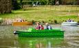 Family on a boat on the lake at Robin Hill Adventure Park, attraction, Isle of Wight, family fun, things to do