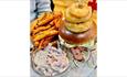 Stacked burger, fries and coleslaw at Bonnygoo Bar & Burger Lounge, Shanklin, Isle of Wight, food, burgers, live music