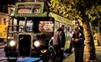 Passenger talking with the driver next to the vintage bus at night time, Wightrider, Isle of Wight Bus & Coach Museum, Ryde, classic buses, what's on