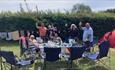 Group of people camping at The Orchards Holiday Park, Isle of Wight