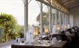 Grand View Restaurant, dining area in conservatory with sea view at Luccombe Hall Hotel, Shanklin, Isle of Wight