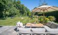 Outside seating area and games in the garden at a property, HB Holiday Lettings, Isle of Wight, self catering, accommodation