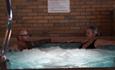 Couple in the jacuzzi at the Sandringham Hotel, Sandown, Isle of Wight, accommodation, coastal hotel, sea view rooms, family friendly hotel