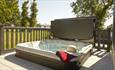 Hot tub on balcony of lodge at St Helens Holiday Resort, Isle of Wight, Self Catering