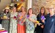 Group of woman holding art flowers, Island Craftworks, art workshop, family, children activities, adult activities, Isle of Wight