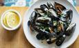 Mussels in a bowl with lemon on the side at Isle of Wight Pearl, cafe, local produce, shopping, things to do, food and drink