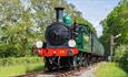 Steam train on tracks surrounded by countryside, Isle of Wight Steam Railway, Things to Do, Isle of Wight