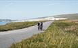 Group of cyclists riding along the Military Road on the Isle of Wight, Joyride Festival, cycling, wellness, health & wellbeing, food, music, what's on