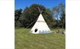 Outside view of tipi with picnic bench, Isle of Wight Tipi Holidays, glamping