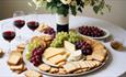 Cheese and grapes platter with glasses of red wine at Wight Cakes & Foods, eat & drink, delivery, Isle of Wight