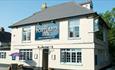 Outside view of the Portland Inn, Gurnard, local produce, pub