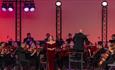 Singer on stage with Bournemouth Symphony Orchestra, Proms 26' on the Isle of Wight, what's on, Things to do, Events, Robin Hill Adventure Park