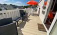 Outside sun deck at Red Squirrel Lodge at Fairway Holiday Park in Sandown, caravan, family friendly, Isle of Wight Stays property