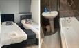 Twin bedroom and bathroom at Abingdon Lodge Hotel, Ryde, Isle of Wight