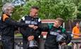 Different generations of family standing in karting gear at Wight Karting, activities, attraction, Isle of Wight