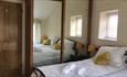 Bedroom with large wardrobe at West View Holiday Cottage, Ryde, Self-catering