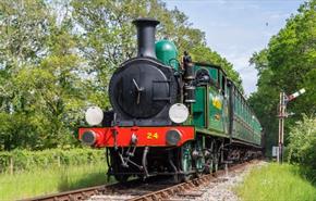 Steam train on tracks surrounded by countryside, Isle of Wight Steam Railway, Things to Do, Isle of Wight