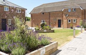 Outside view of the courtyard gardens within the cottages at Island Riding Centre, self catering, Newport, Isle of Wight