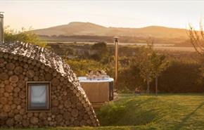 Outside view of Modulog with hot tub at Tapnell Farm, Isle of Wight, glamping, self catering - image credit: Skarsgard