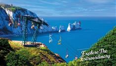 View of the Needles in the background with people on the chairlift, The Needles Landmark Attraction, Isle of Wight, Things to Do