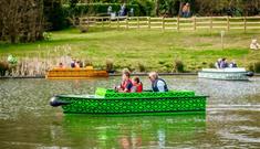 Family on a boat on the lake at Robin Hill Adventure Park, attraction, Isle of Wight, family fun, things to do
