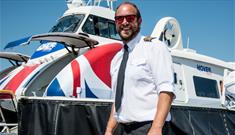 Pilot standing with the hovercraft in the background, Hovertravel's Hovercraft Flight Experiences, things to do, tour, history, activities, Isle of Wi