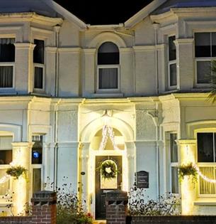 Outside view of Fernhurst Holiday Apartments with festive decorations, self catering, Shanklin