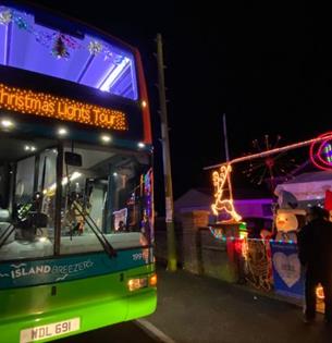 Southern Vectis bus in front of Christmas lights, Isle of Wight, event, what's on